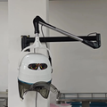 Wall mounted hooded hair dryer
